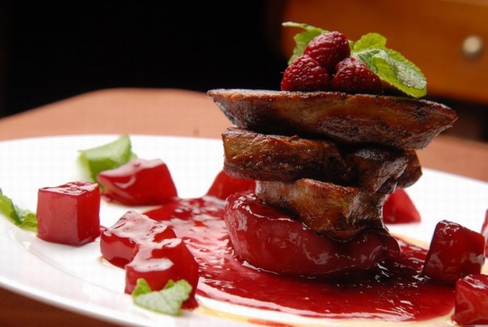 Roasted goose liver with raspberry sauce and fresh raspberries